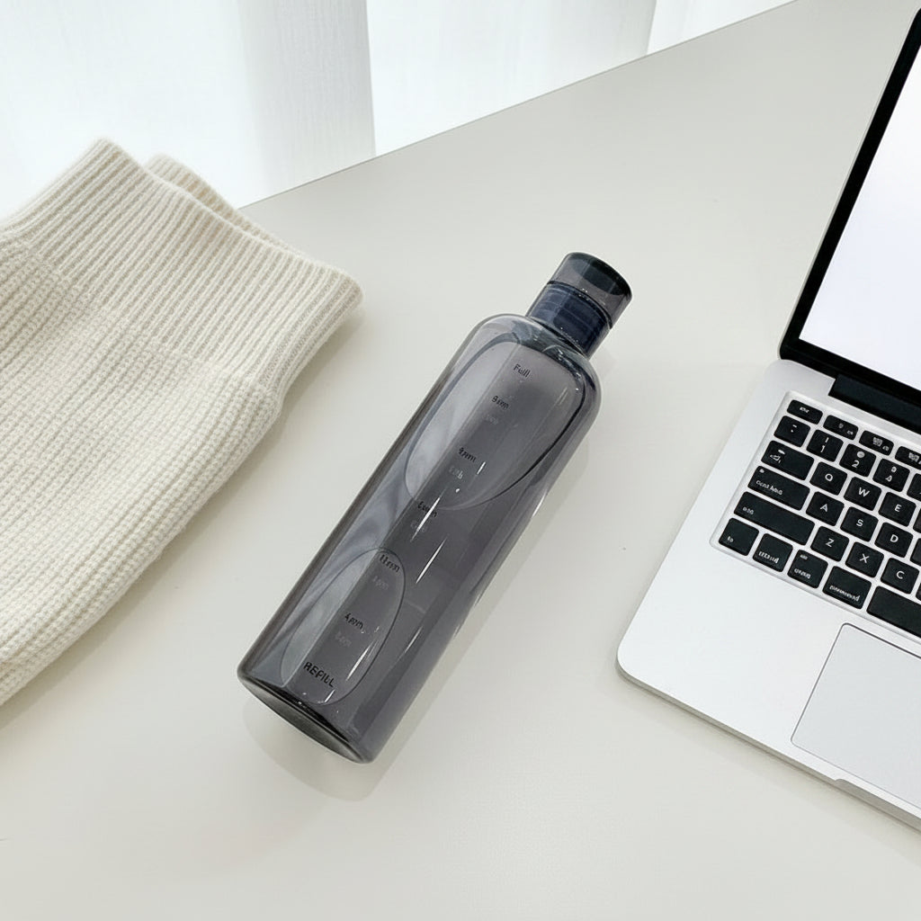 The Nudge Daily bottle in clear frosted finish showing water level markers